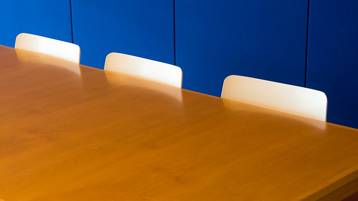 A meeting space where internal calendars are being compared